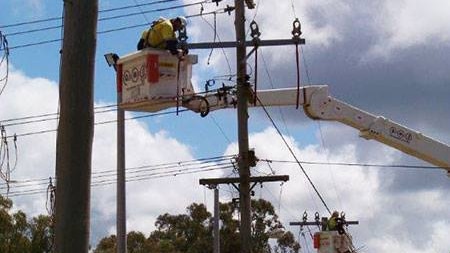 Power line repairs by Essential Energy crews