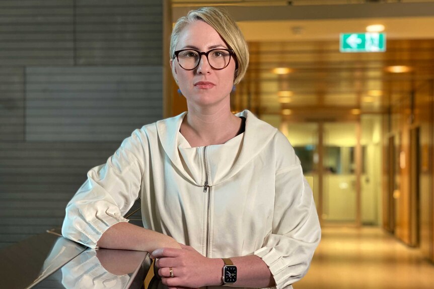 Dr Annaliese van Diemen wears glasses.