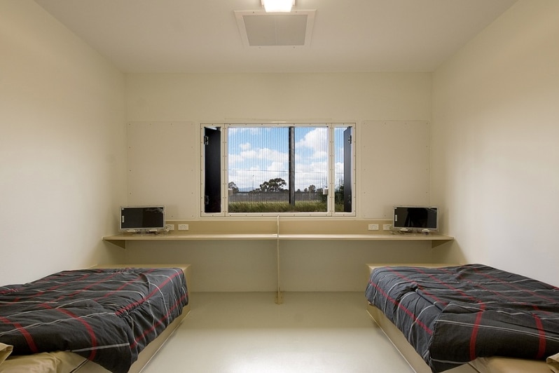 a cell with two single beds in each end