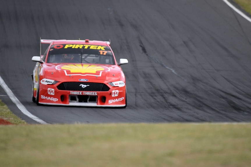 A Supercars driver on the circuit at the Mount Panorama Circuit in Bathurst.