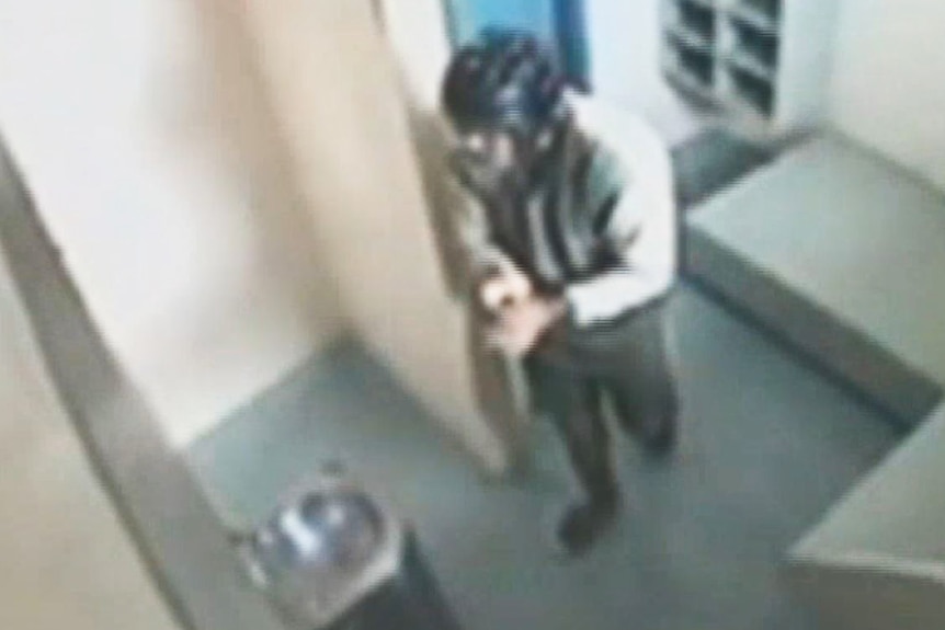 CCTV image of a teenager in a mask inside a prison cell