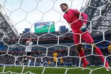 Germany's Julian Draxler (L) scores penalty against Australia's Mat Ryan at the Confederations Cup.