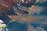 A satellite image shows south-eastern Australia through clouds and copious amounts of brown bushfire smoke.