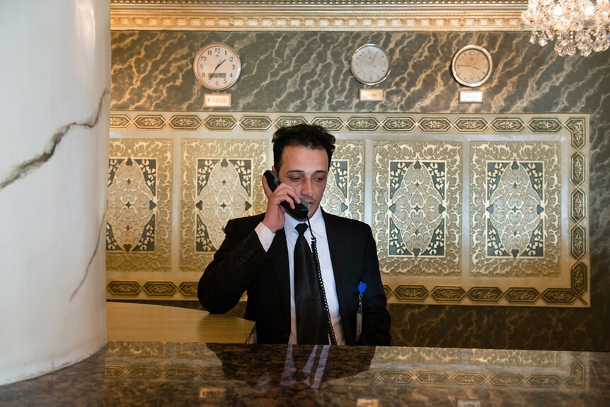 The concierge works the phones.