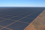 A computer-generated rendering of thousands of solar panels on red dirt.