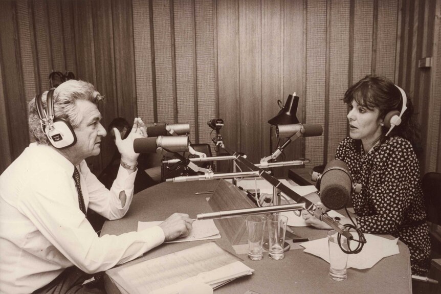 Black and white photo of Margaret Throsby interviewing Bob Hawke in ABC radio studio.