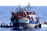 Italian Navy rescues migrants from a boat on the Mediterranean Sea