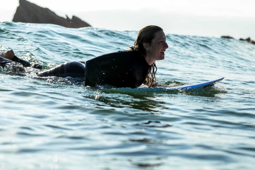 woman surfing