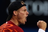 Hewitt fights into second round