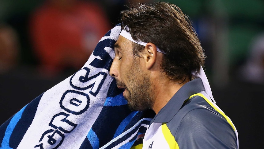 Baghdatis wipes his face