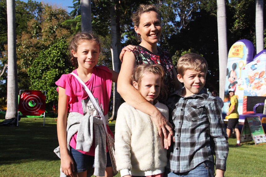 A woman with her three children.