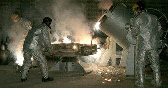 Technicians process uranium in a plant in Iran