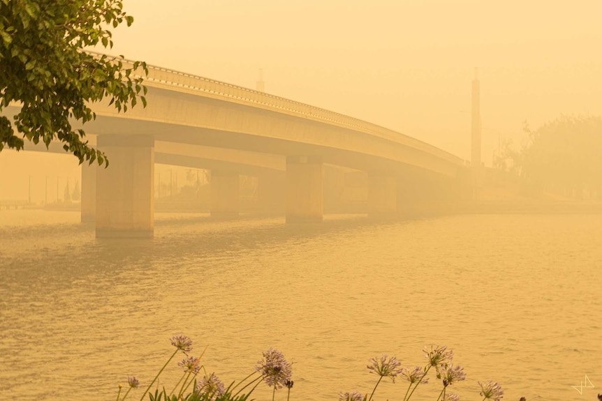 Commonwealth bridge is covered in smoke