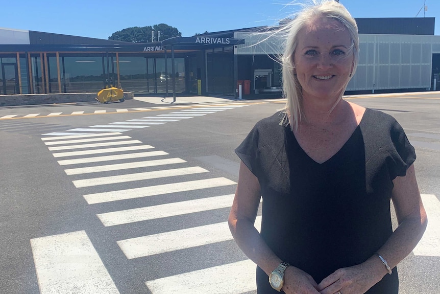 Woman standing at Mount Gambier Regional Airport.