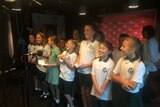 Jannali Public School choir perform their national anthem in the 702 ABC Sydney studio