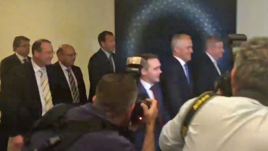 Peter Hendy (second from left) enters the party room meeting with Malcolm Turnbull. (14 September 2015)