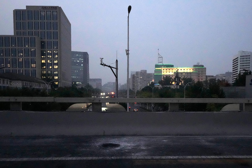 Scorched pavement is seen on the side of a highway overpass.