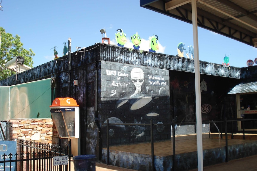 An outback roadhouse with aliens painted on the outside.