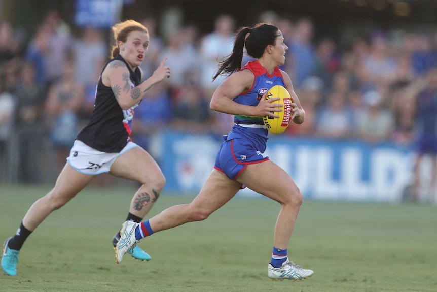 Brooke Lochland makes a break for the Bulldogs against Carlton in the AFLW.