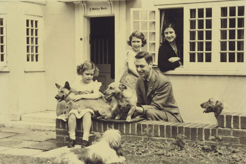 King George VI and Queen Elizabeth with Princesses Elizabeth and Margaret and some canine companions including Dookie and Jane.