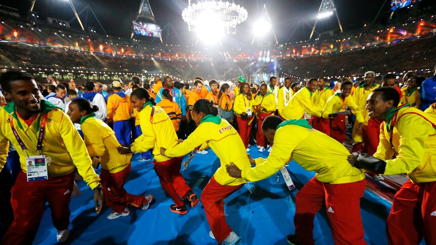 Ethiopian athletes form a conga line at the closing ceremony of the London 2012 Olympic Games