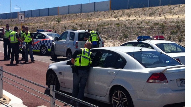 Police cars on Alexander Drive, Mirrabooka after a police chase ends in a crash 18 October