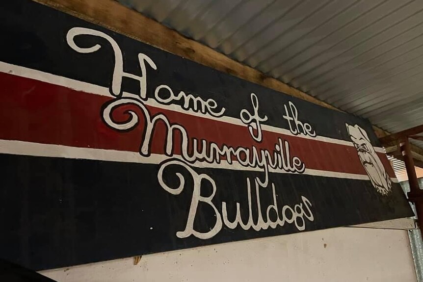 A red, blue and white banner which reads home of the Murrayville Bulldogs. 