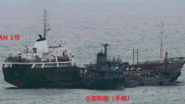 Two ships floating next to each other in the East China Sea