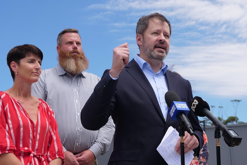 A minister at a press conference.