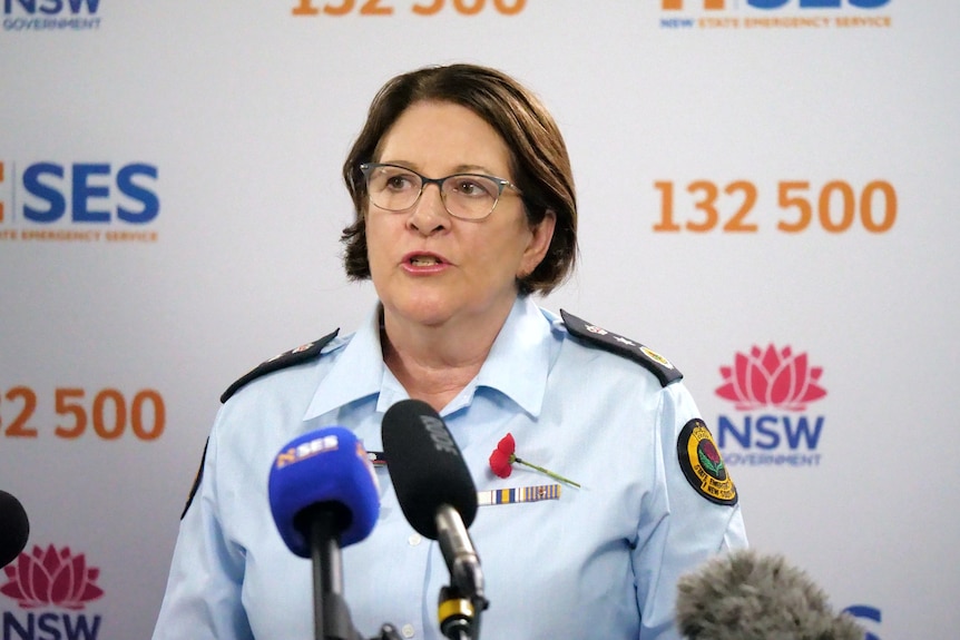 Woman in SES uniform fronting press conference 