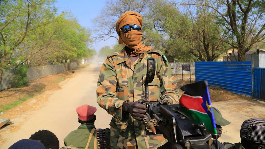 South Sudanese soldier mans a machine gun
