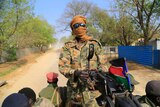 South Sudanese soldier mans a machine gun