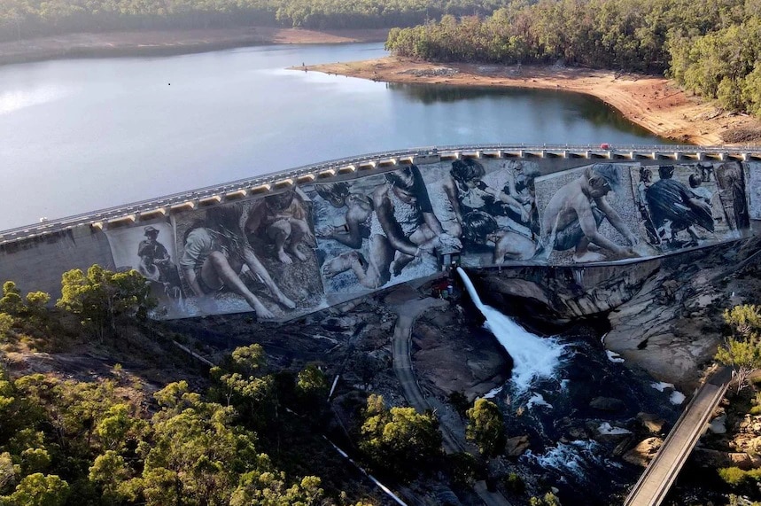 A huge mural painted on the side of a dam wall in southwestern WA.