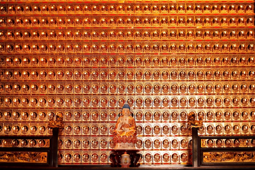 Buddha statues covered with gold leaf are placed at Ten Thousand Buddhas Monastery in Hong Kong, China December 12, 2017