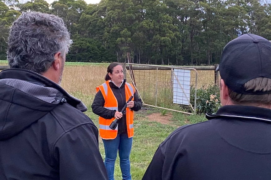 Bird Beam director Michelle Kerr explains the laser technology to farmers.