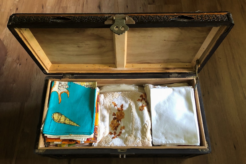 Towels inside a wooden box.