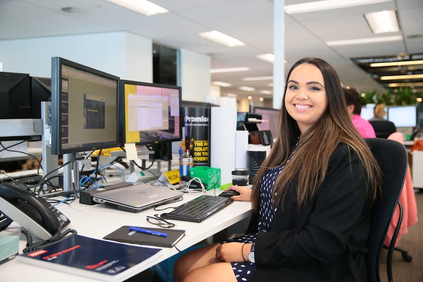 Amanda at a desk in an office