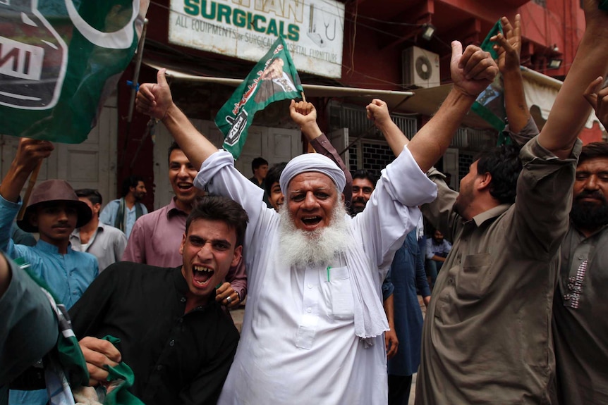 Pakistan's opposition party supporters celebrate.