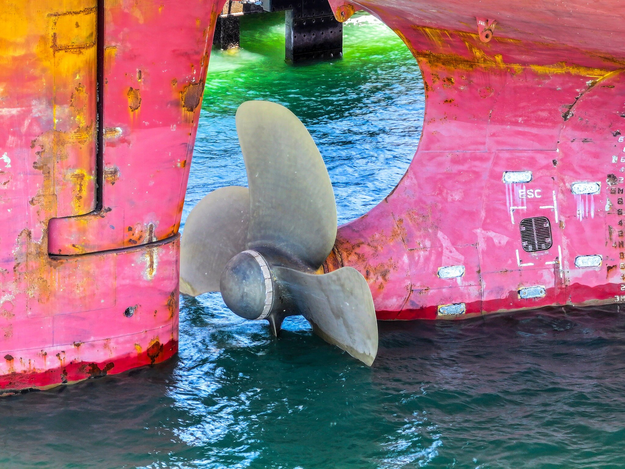 A photo of a propeller on a ship in the water