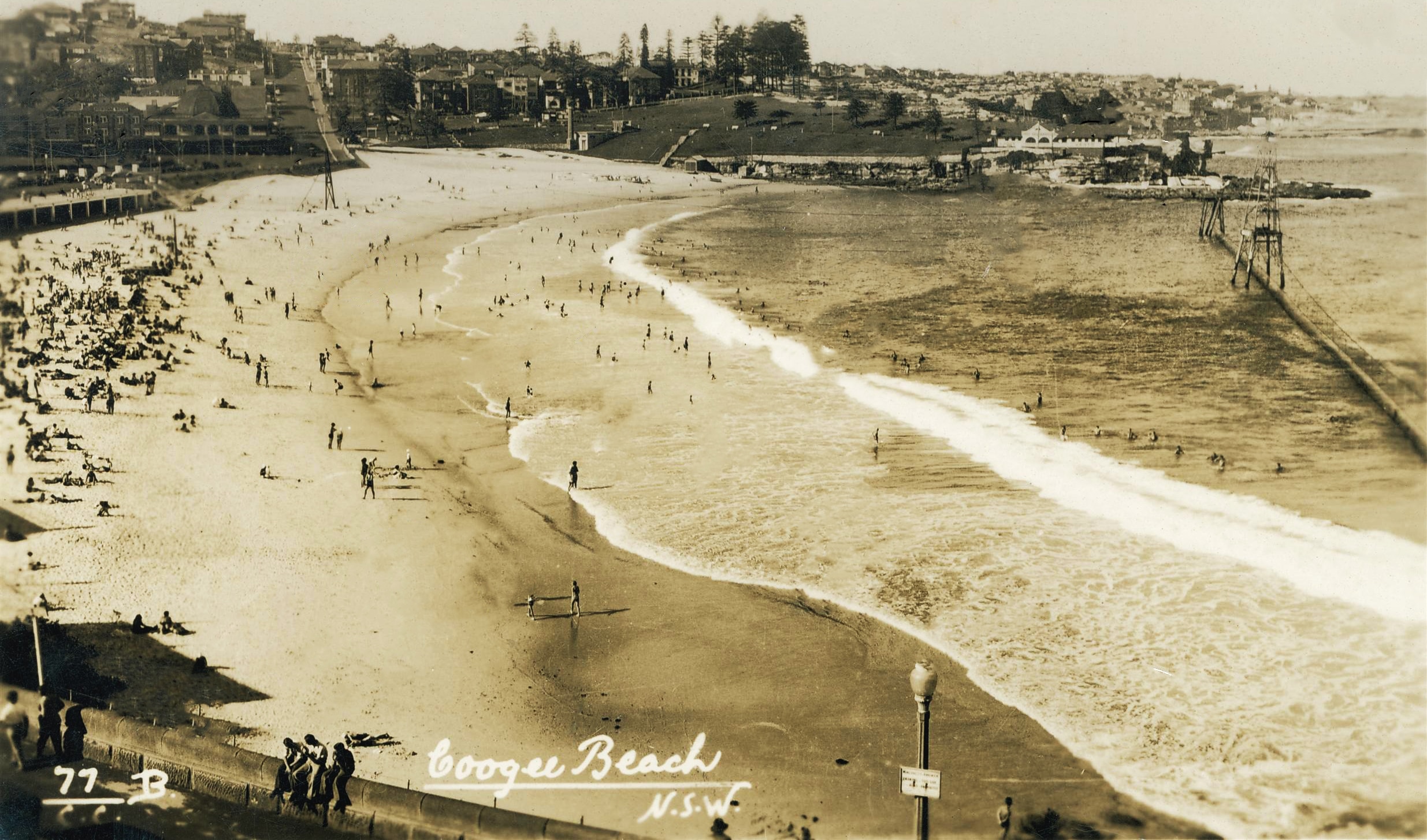a sepia grade photo showing a long net running the length of a beach