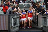 Brisbane Lions players walk out at the MCG
