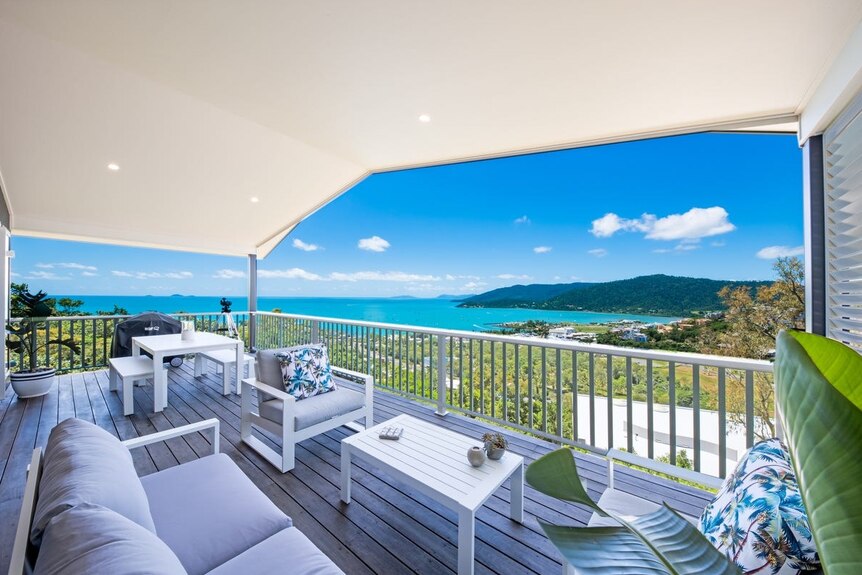 A stunning costal view from a covered verandah.