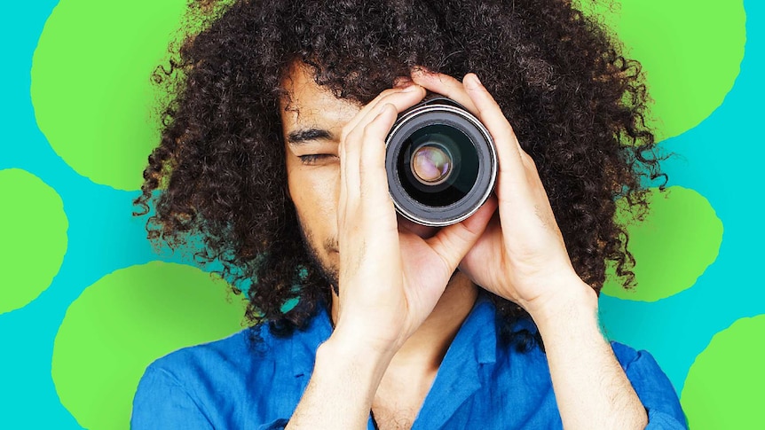 Man in blue shirt looks through telescope with green and blue background to depict how to search for the best expert.