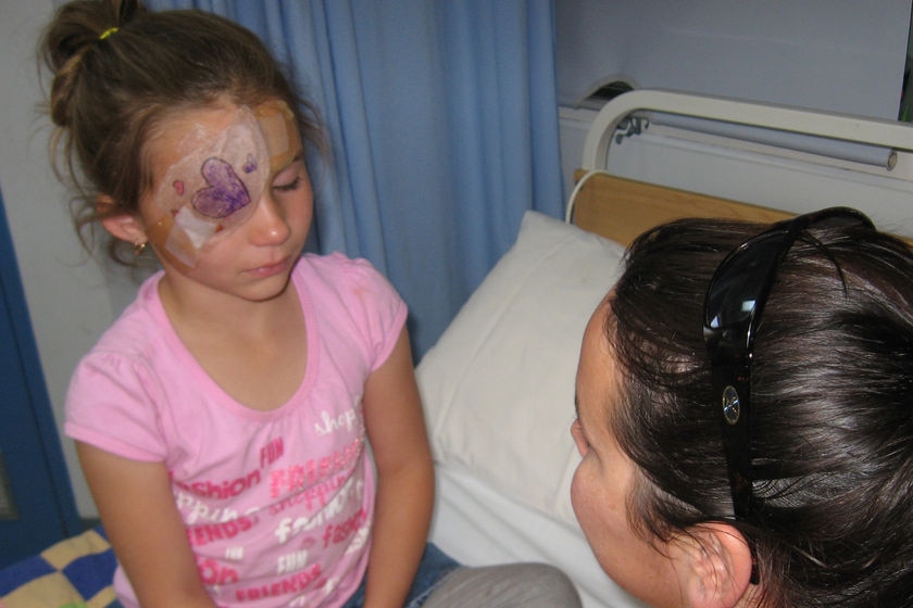 Maddison Hall, with her mother Tara Hall, after a magpie attack in Mandurah.