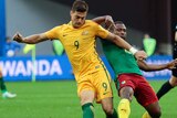 Tomi Juric on the ball for Australia against Cameroon.