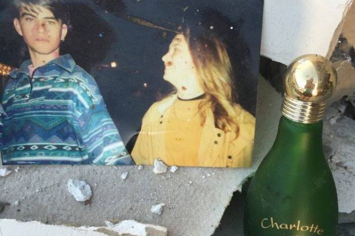 Photograph and perfume bottle left behind