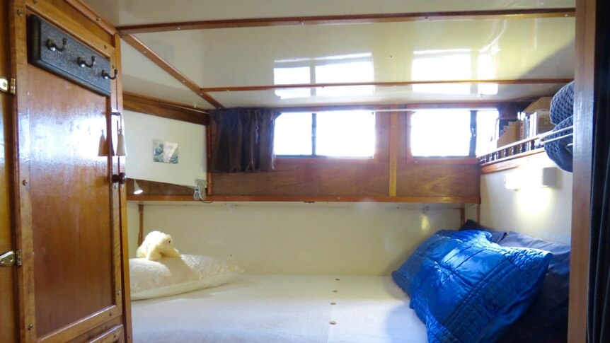 The interior of a bedroom cabin on a boat