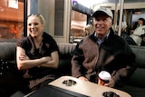 Meghan McCain and her father, senator John McCain, are pictured sitting in a booth in a restaurant.