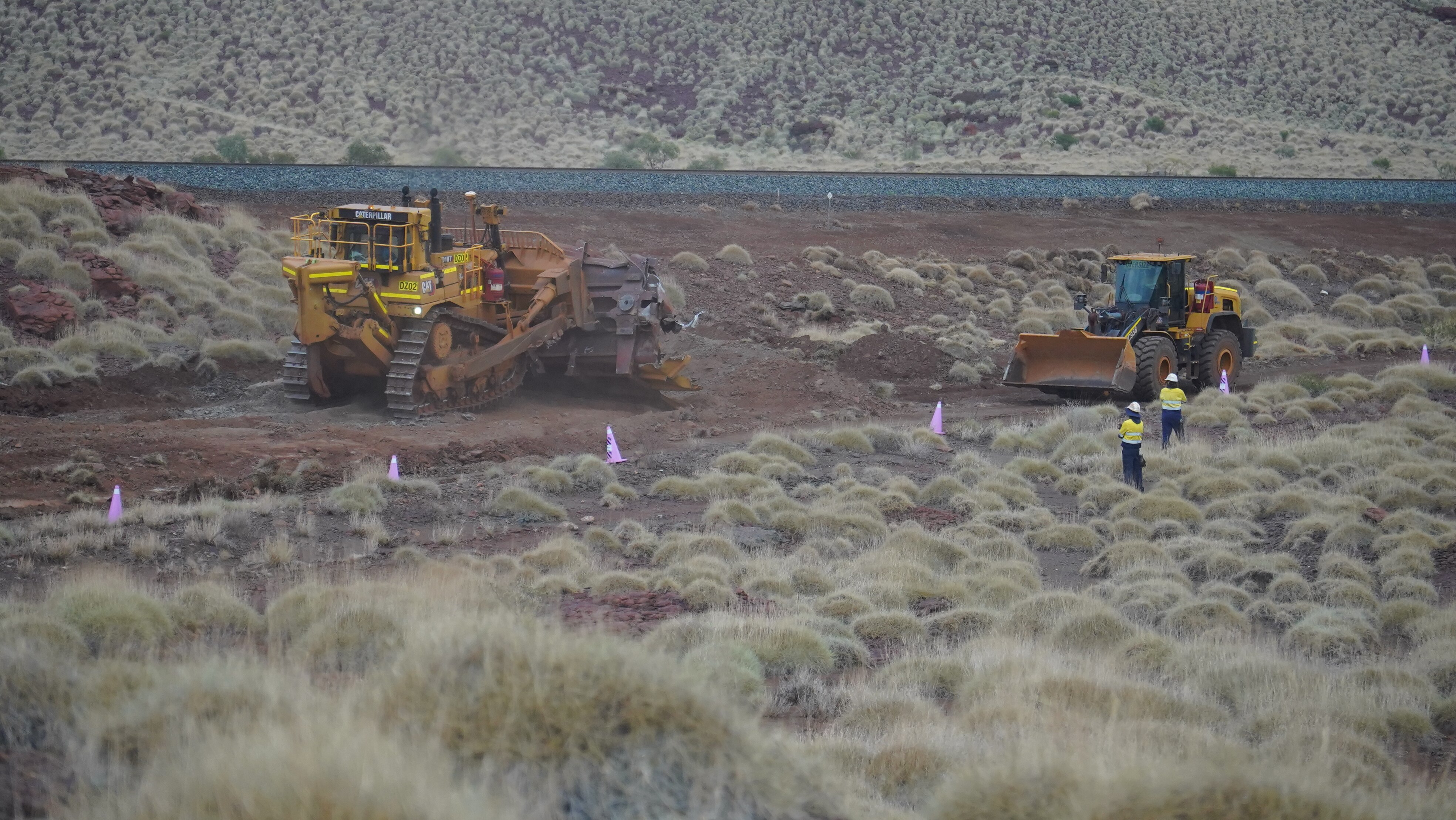 A bulldozer and digger at a train derailment site in Western Australia's Pilbara region.