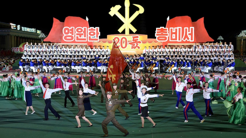 A group of North Koreans dance and sing during the celebrations in North Korea.